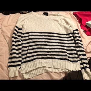 Long sleeve white shirt with blue stripes.